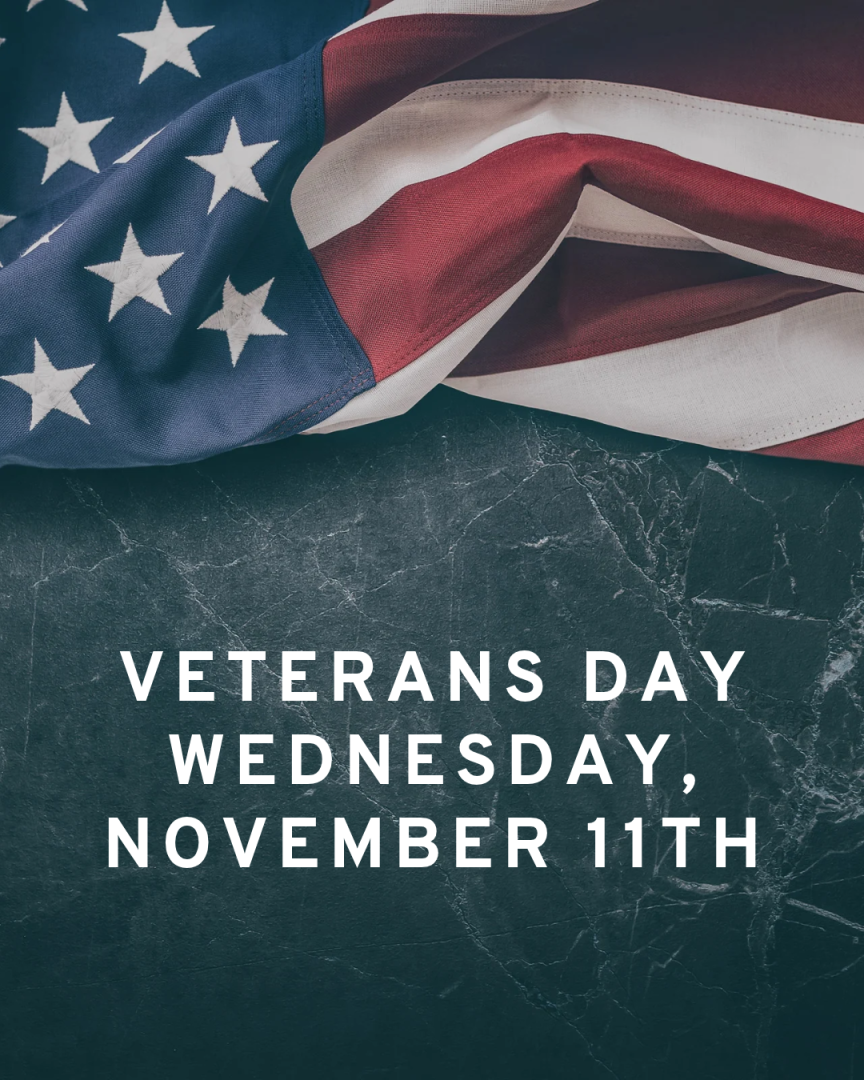 Veterans day Wednesday November 11th-folded American flag on dark marble